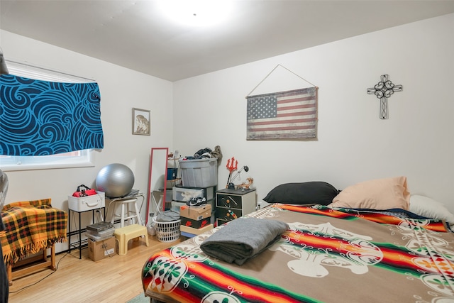 bedroom with wood-type flooring