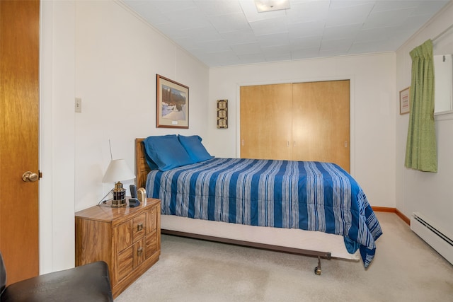 carpeted bedroom featuring ornamental molding and a baseboard radiator