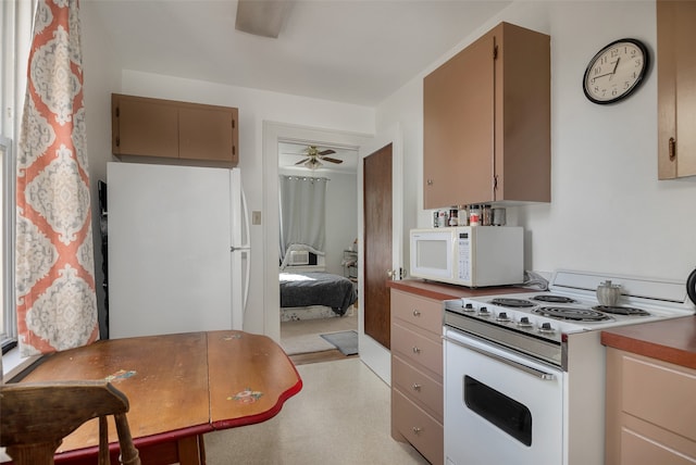 kitchen with ceiling fan and white appliances