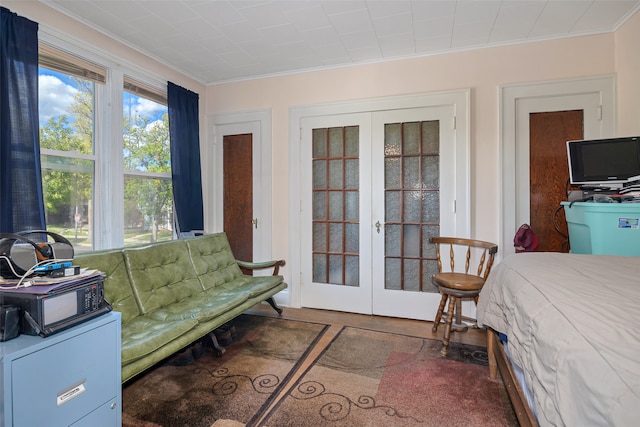 bedroom with crown molding and french doors