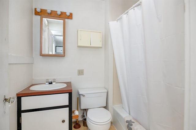 bathroom with toilet and vanity