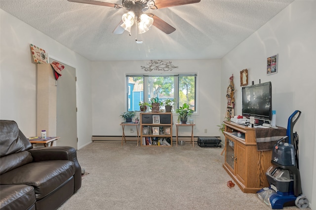 carpeted living room with a textured ceiling, baseboard heating, and ceiling fan