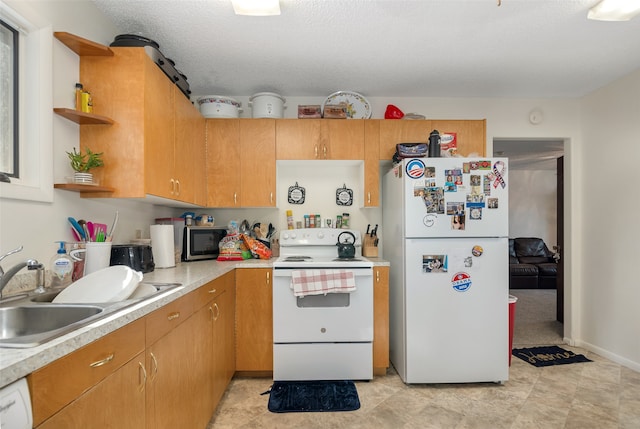 kitchen with white appliances, a textured ceiling, and sink