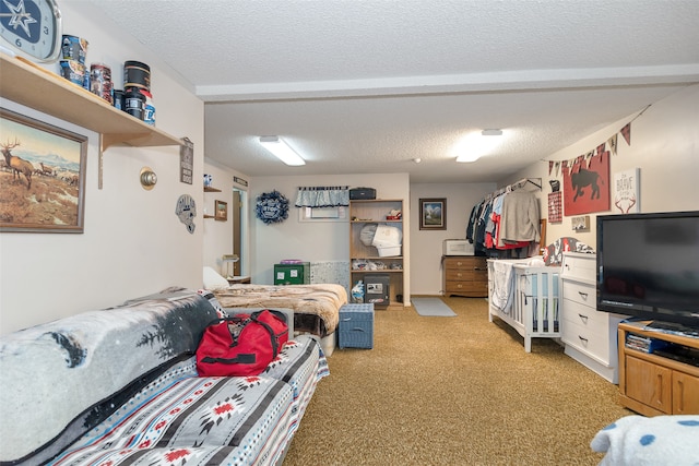 carpeted bedroom with a textured ceiling