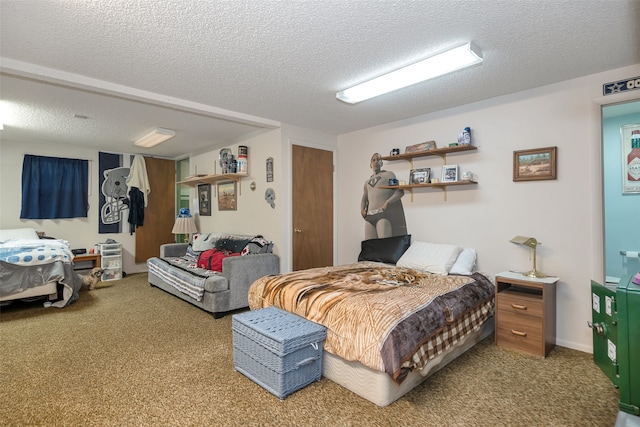 bedroom featuring a textured ceiling and carpet floors