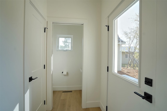 doorway to outside featuring light hardwood / wood-style flooring