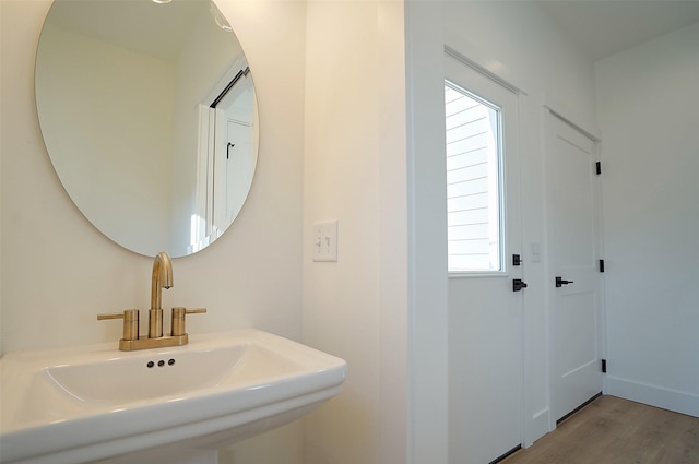 bathroom featuring sink and hardwood / wood-style floors