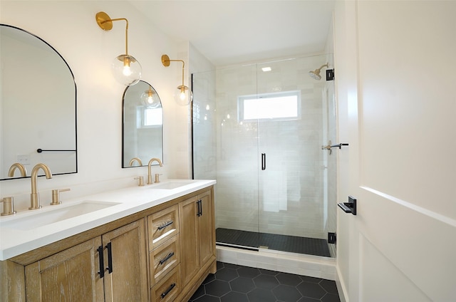 bathroom featuring vanity, a shower with shower door, and tile patterned flooring