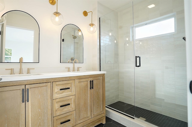 bathroom featuring walk in shower and vanity