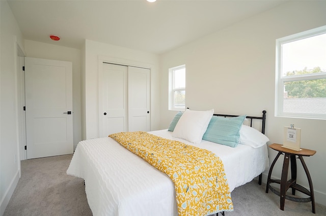 carpeted bedroom with a closet