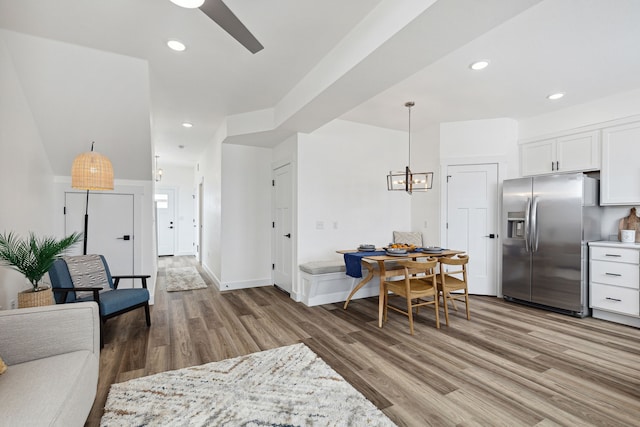 living room with wood finished floors and recessed lighting