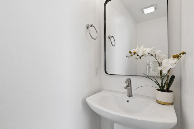 bathroom with a sink and visible vents