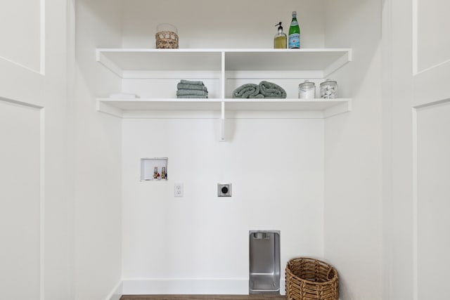 laundry room with electric dryer hookup, baseboards, and washer hookup