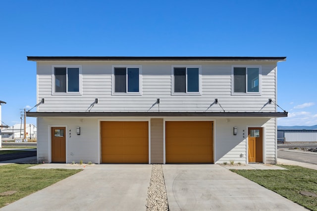 view of front facade featuring a garage and concrete driveway