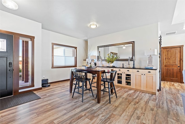 dining room with light hardwood / wood-style flooring