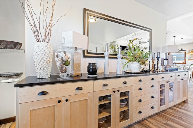 kitchen featuring light brown cabinets and light hardwood / wood-style floors