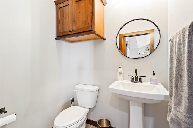 bathroom featuring sink and toilet