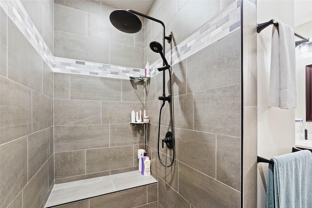 bathroom with a tile shower