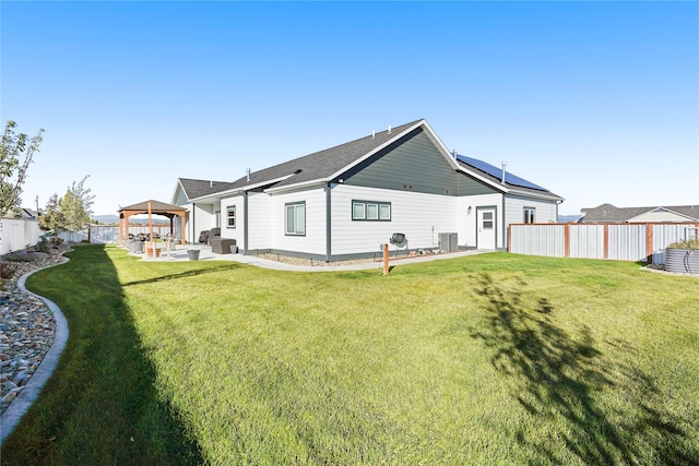 back of house with a gazebo, central AC, a patio area, and a yard