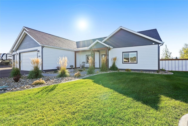 ranch-style house with a garage and a front yard