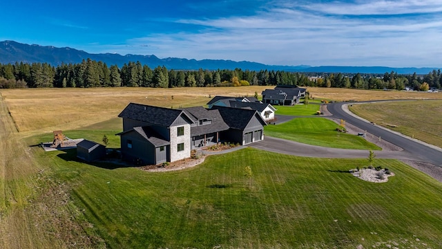 birds eye view of property with a mountain view