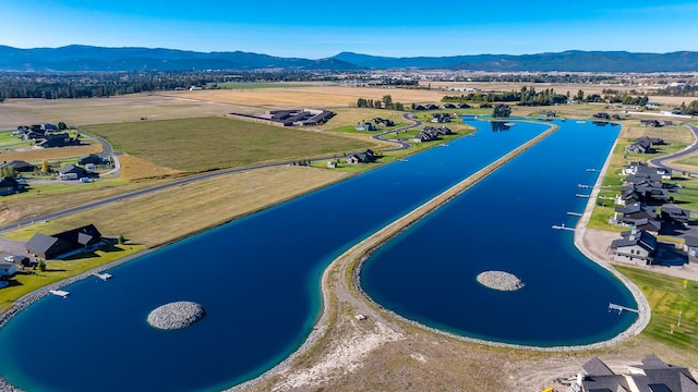 birds eye view of property featuring a residential view and a water and mountain view