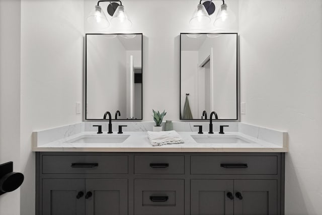 bathroom featuring double vanity and a sink