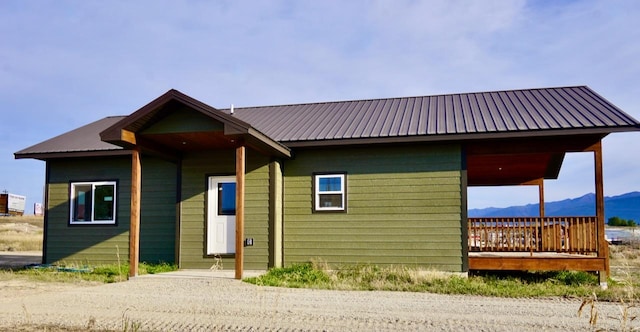 72 River Ct N, Eureka, MT 59917 - view of front of home with a mountain view and metal roof