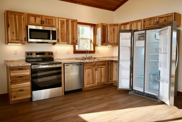 72 River Ct N, Eureka, MT 59917 - kitchen featuring appliances with stainless steel finishes, dark wood-style flooring, lofted ceiling, wood ceiling, and a sink