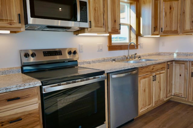 72 River Ct N, Eureka, MT 59917 - kitchen featuring dark wood-type flooring, a sink, light brown cabinetry, and stainless steel appliances