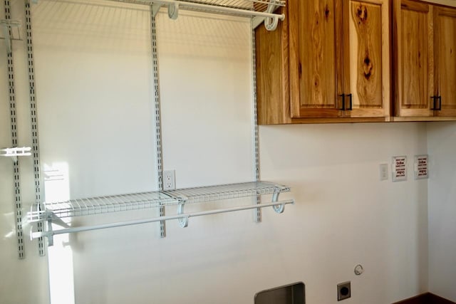 72 River Ct N, Eureka, MT 59917 - washroom with hookup for an electric dryer and cabinet space