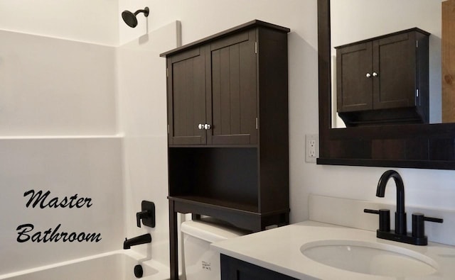 72 River Ct N, Eureka, MT 59917 - bathroom featuring washtub / shower combination, vanity, and toilet