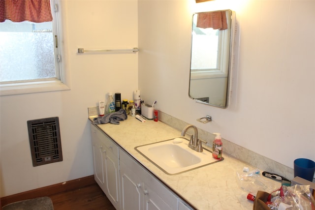 bathroom featuring hardwood / wood-style floors and vanity