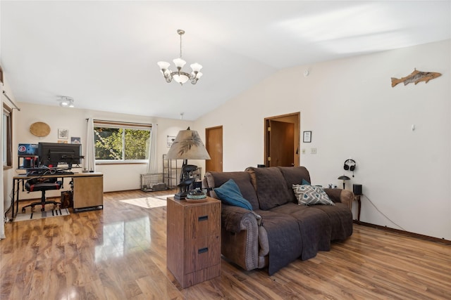 1627 Foothill Rd, Kalispell, MT 59901 - living area featuring a chandelier, wood finished floors, lofted ceiling, an office area, and baseboards