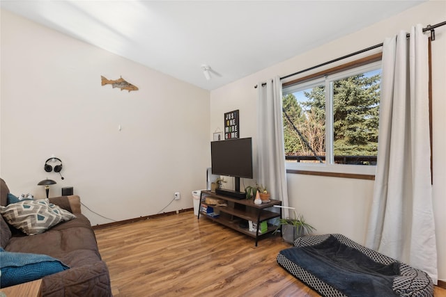 1627 Foothill Rd, Kalispell, MT 59901 - living room with light wood-type flooring, lofted ceiling, and baseboards