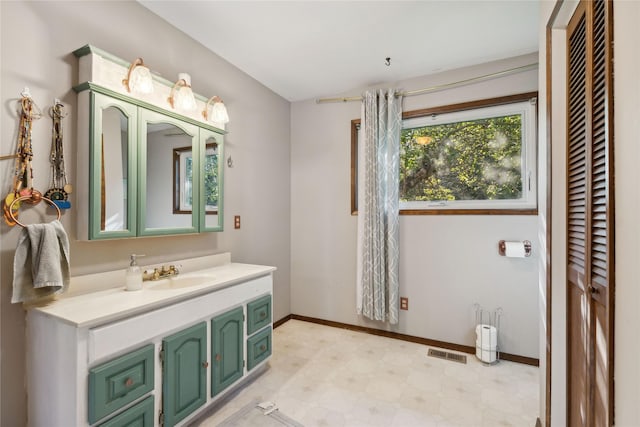 1627 Foothill Rd, Kalispell, MT 59901 - bathroom with vanity, baseboards, and tile patterned floors