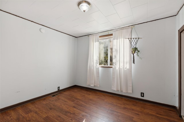 1627 Foothill Rd, Kalispell, MT 59901 - empty room featuring dark wood-type flooring, baseboards, and a smoke detector