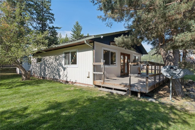 1627 Foothill Rd, Kalispell, MT 59901 - view of property exterior with a deck and a yard