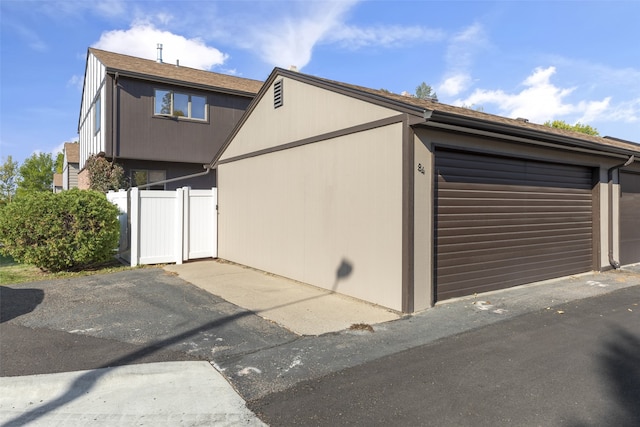 view of property exterior with a garage