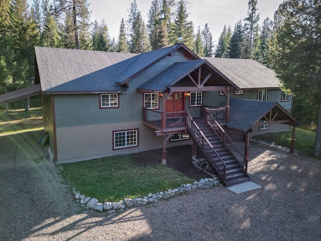 44 Copper Ridge Rd, Trout Creek, MT 59874 - view of front of property featuring a front lawn, roof with shingles, a porch, and stairs