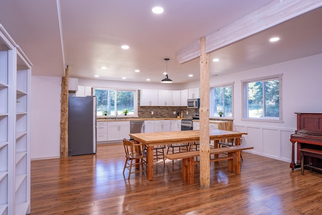 44 Copper Ridge Rd, Trout Creek, MT 59874 - dining area featuring dark wood-type flooring, a wainscoted wall, and recessed lighting