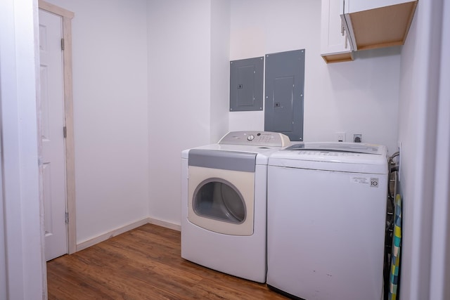 44 Copper Ridge Rd, Trout Creek, MT 59874 - clothes washing area with washing machine and clothes dryer, cabinet space, wood finished floors, and electric panel