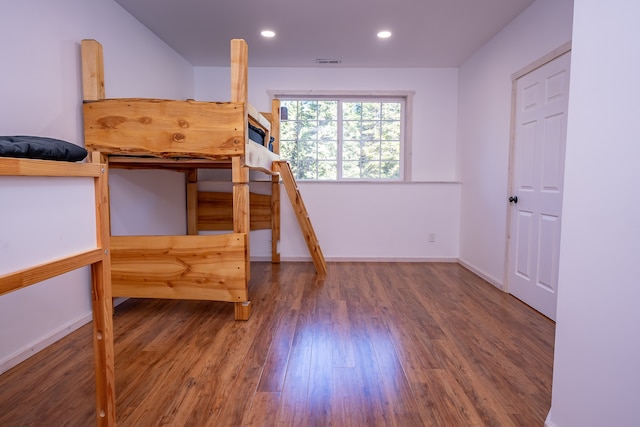 unfurnished bedroom featuring dark wood-type flooring