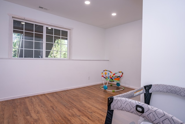 bedroom with wood-type flooring