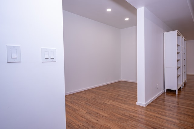 additional living space featuring dark wood-type flooring