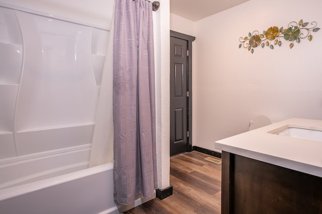 bathroom featuring shower / tub combo, vanity, and wood-type flooring