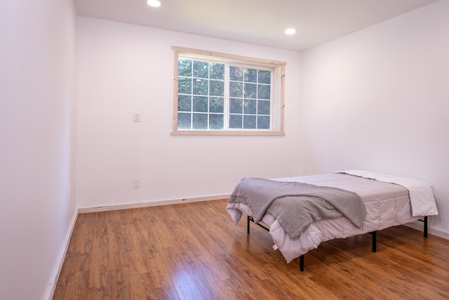 bedroom featuring wood-type flooring