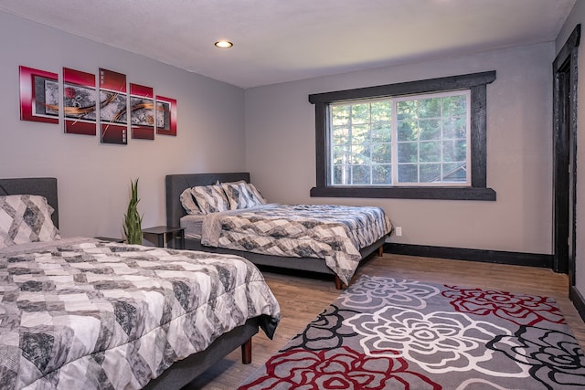 bedroom featuring hardwood / wood-style floors