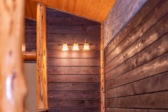 room details featuring wood walls and wood ceiling