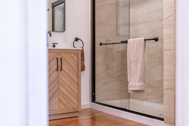 44 Copper Ridge Rd, Trout Creek, MT 59874 - full bathroom with a shower stall, vanity, and wood finished floors